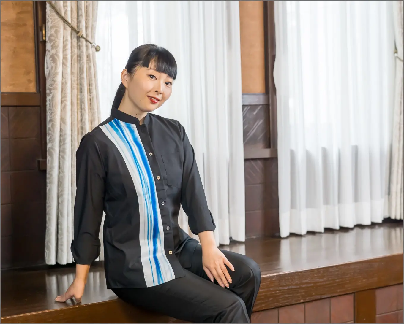 Close-up of uniform collar with cherry blossom embroidery detail